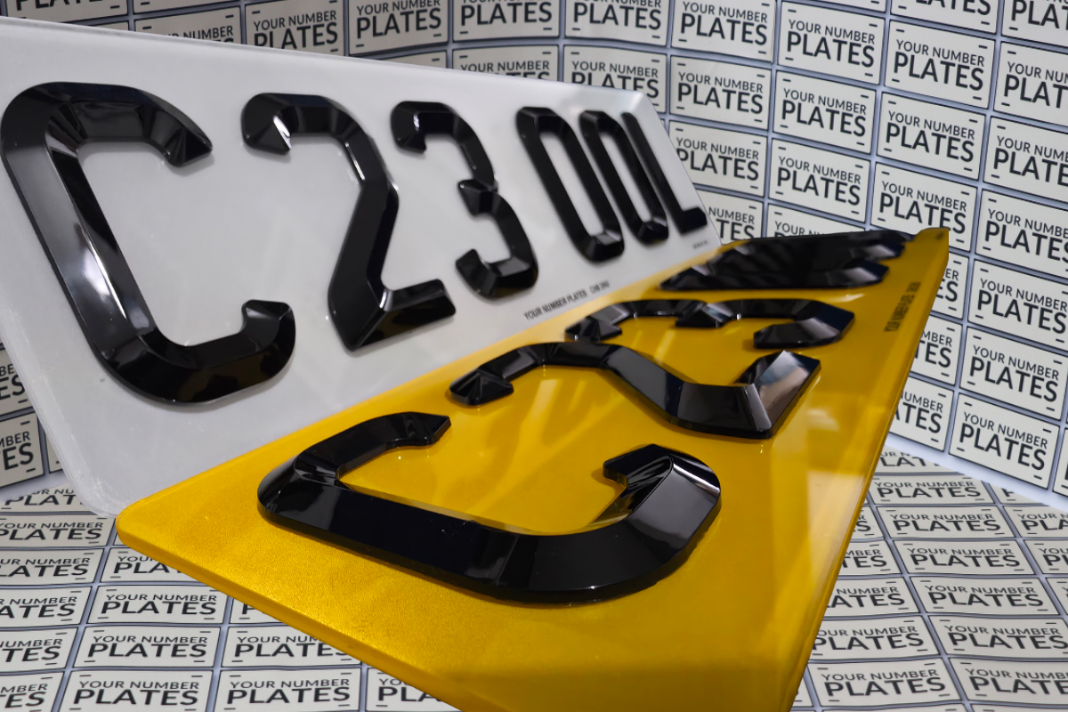 close up of diamond raised digits on short number plate